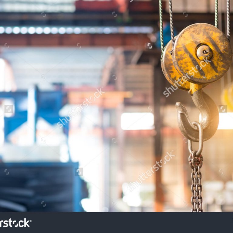 stock-photo-empty-warehouse-interior-with-crane-hook-380507725
