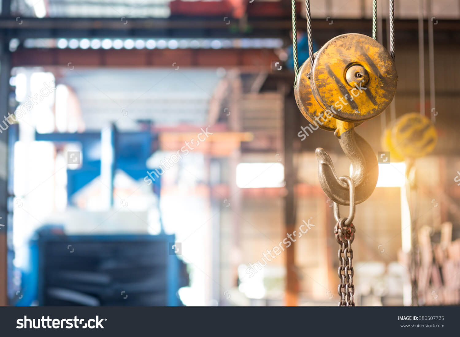 stock-photo-empty-warehouse-interior-with-crane-hook-380507725